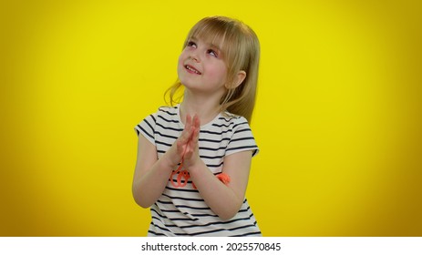 Sneaky Cunning Playful Child Girl With Tricky Face Gesticulating And Scheming Evil Plan, Thinking Over Devious Villain Idea, Cunning Cheats, Jokes And Pranks. Yellow Wall Background. Teen Kid Children