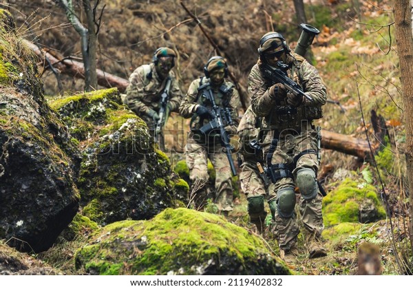 Sneaky guerrilla warfare special task\
regiment in the jungle . High quality\
photo