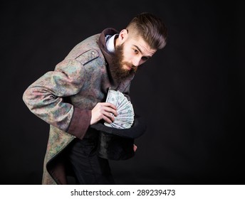 Sneaky Man Taking Out Money From His Hat.