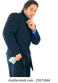 Sneaky Young Caucasian Businessman Hiding Money On His Pocket. Concept For Corruption