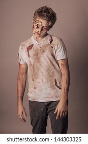 Sneering Teenager Zombie In Torn Bloody Shirt