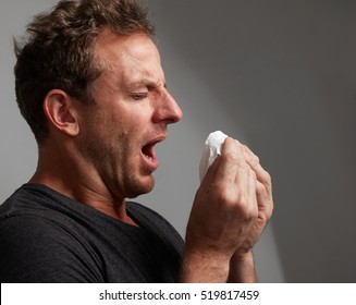 Sneezing Man With Cold