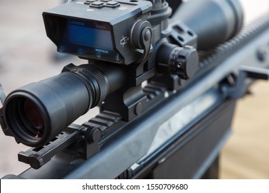 Sniper Gun, Optics Scopes Close Up. Elements Of The Sniper Rifle With Tactical Body . Selective Focus