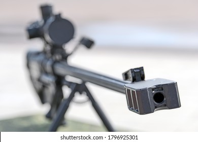 Sniper Rifle Gun Barrel Front View. Silhouette Of Lethal Firearms. Rifle Silencer. Army Light Weapon For Soldier. Dangerous Equipment. Narrow Focus