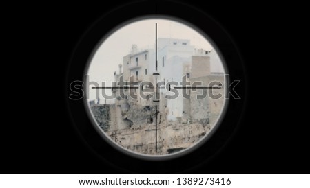 A sniper scope pointing at a medieval small town on a cliff by the sea, in a cloudy day with a thin mist.
