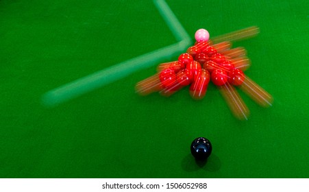 Snooker Break With Long Exposure To Show White Hitting Red Triangle And The Balls Movings On Full Size Billiards Table