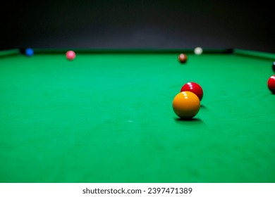 Snooker table and snooker balls.