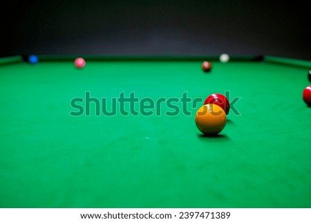 Snooker table and snooker balls.