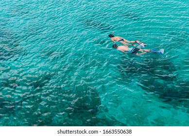 Snorkeling in clear tropical sea.