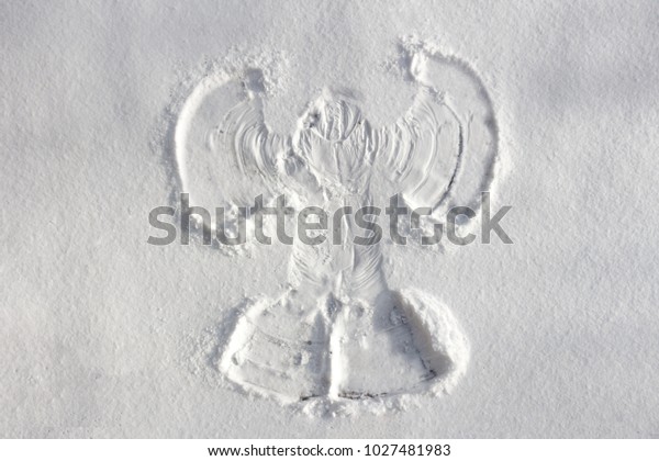 Snow angel made in the white\
snow