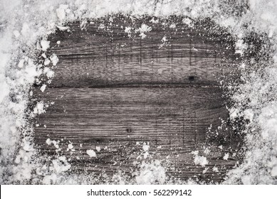 Snow Background Card On Wooden Table. Top Of View.