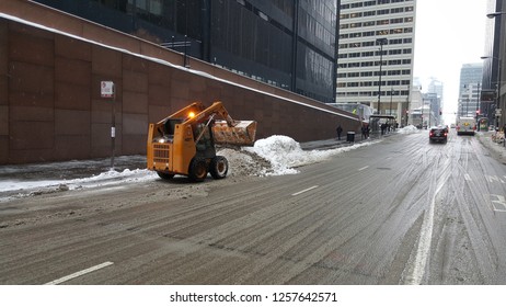 Snow Being Dumped Into A Snow Pile With A Case 40XT Skid Steer Loader After A Winter Snowstorm, Chicago, IL February 9th, 2018