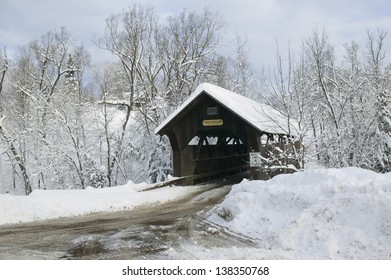 A Snow Blanketed Emily's Covered Bridge In Stowe Vermont, USA