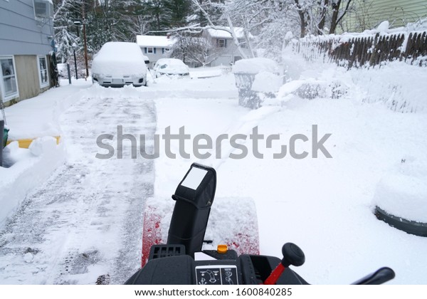 snow blower cleaning\
snow on the driveway