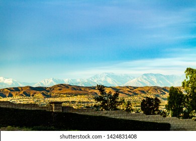 Snow Capped Mountains Above The Hills Of Anaheim California.