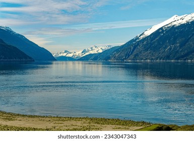 Snow Capped Mountains Beyond Icy Lagoon near Skagway, Alaska - Powered by Shutterstock