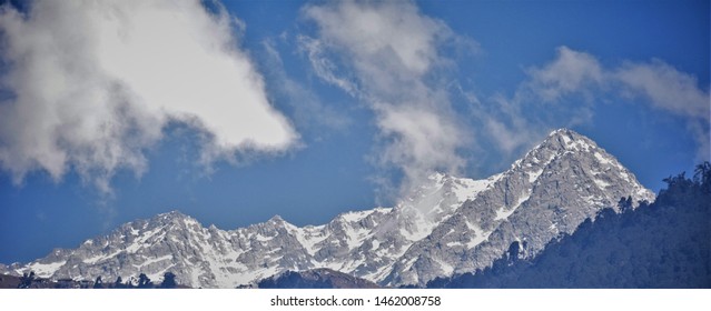 Snow capped mountains with blue skies