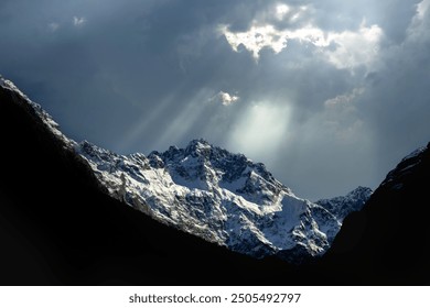 Snow capped mountains and foreground hill silhouette - Powered by Shutterstock