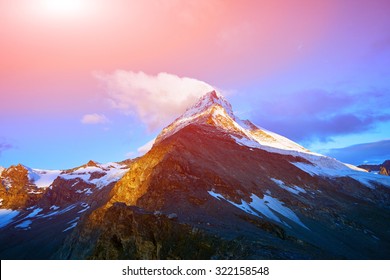 Snow capped mountains.   View of the  Matterhorn mount at the sunrise.