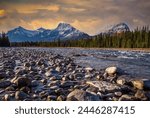 Snow capped Mt Fryatt and other peaks and the Athabasca River  in the Canadian Rockies, viewed from the Icefields Parkway, which extends from Banff to Jasper, Alberta, Canada.