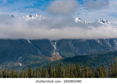 Snow Capped North Cascade Mountain Range. A fresh powdering of snow on the peaks surrounding the Mt. Baker area of western Washington state.