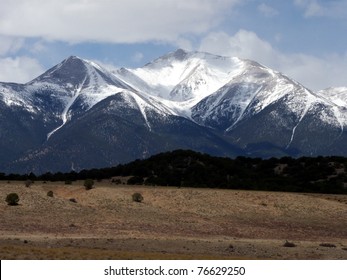 Snow Capped Peaks In The Colorado Rockies During Early Spring