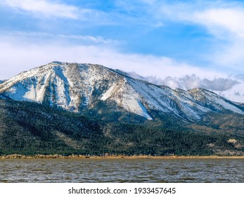 Snow Capped Slide Mountain Near Reno Nevada As Seen From Washoe Lake.	