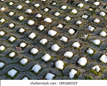 Snow Caps On Grass Pavers In Winter In Germany