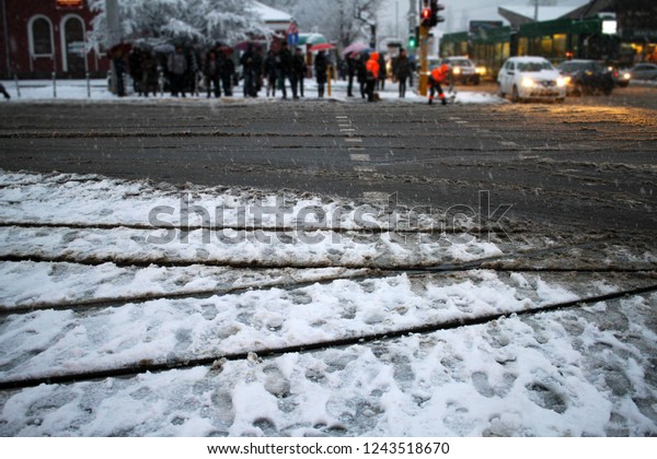 Snow in the city. Winter snow fall landscape. Street\
covered with snow and ice. Road in winter time. Cold concept.\
Snowstorm. 