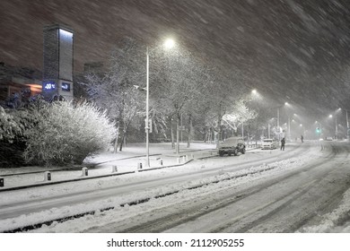 Snow cityscape of a street in Istanbul Turkey with a blizzard.
Winter snowstorm 2022 in Istanbul. A snow-covered road with people and cars in a storm.