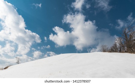snow and clouds on the hill