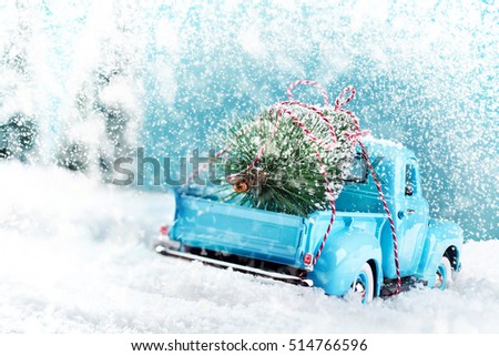 Snow countryside with christmas tree truck driving home