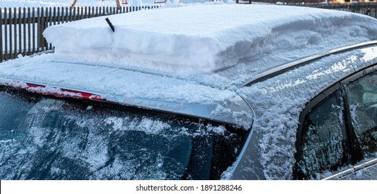 Snow Cover On A Car Roof Danger In Traffic