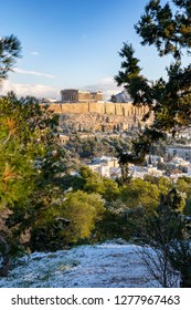 The Snow Covered Acropolis Of Athens, Greece, During A Sunny Winter Day