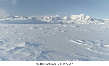 Snow Covered Antarctic Surface Aerial View Flight. South Pole Ice Landscape. Winter Frozen Ground Continent Snowy Frost Rock Epic Drone Fly - Powered by Shutterstock