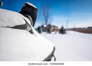 Snow Covered BBQ Smoker Grill In The Backyard With Winter Background