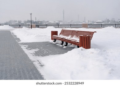 Snow covered benches on the embankment against the background of the frozen river in Siberia, Irkutsk - Powered by Shutterstock