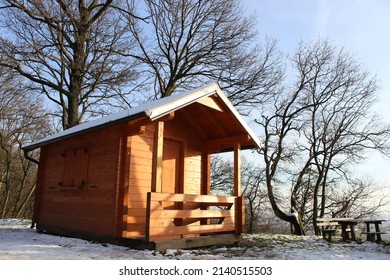 A Snow Covered Cabin On Top Of A Mountain During The Cold Winter. Total Relaxation Inside Warm With A Breathtaking Window View