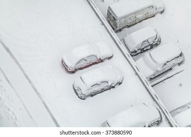 Snow Covered Cars In Parking Lot