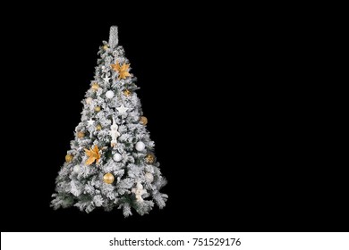 With Snow Covered Christmas Tree Decorated In White And Gold In Front Of A Black Background