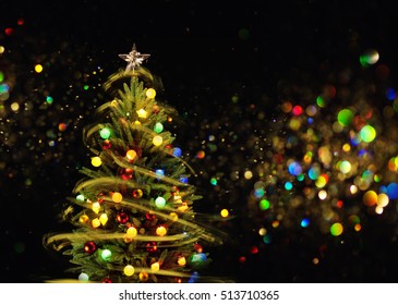 Snow Covered Christmas Tree With Multi Colored Lights At Night.