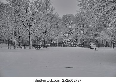 A snow covered empty playground during a snowstorm.  - Powered by Shutterstock