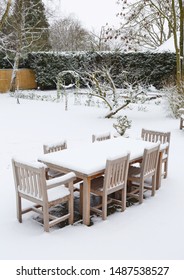 Snow Covered English Garden And Patio Furniture, UK