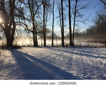 Snow Covered Field At End Of Day