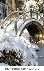 Snow Covered Footbridge In Japanese Garden