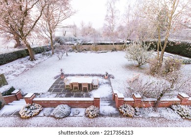 Snow Covered Garden In Winter, UK. Large Country Backyard Or Garden In Wintry Scene