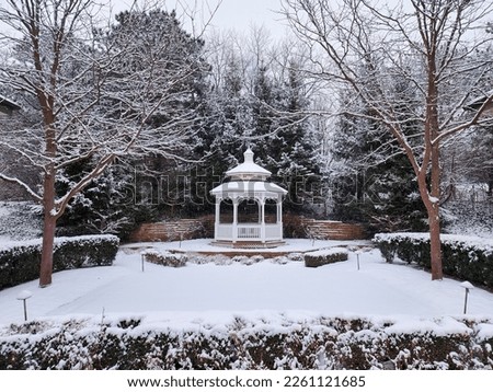 A snow covered gazebo and small courtyard in Ann Arbor Michigan. 