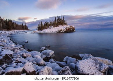 Snow covered island on Lake Superior during sunset. - Shutterstock ID 1918477106
