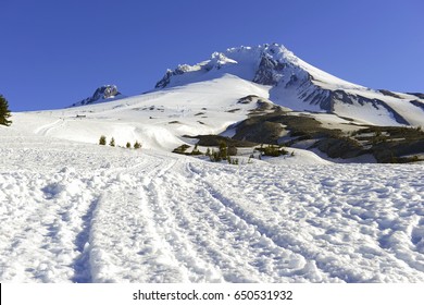 Snow covered Mount Hood, a volcano in the Cascade Mountains in Oregon popular for hiking, climbing, snowboarding and skiing, despite the risks of avalanche, crevasses and volatile weather on the peak.