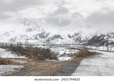 Snow covered Mountains overlooking Alaska Highway 4 north of Valdez - Powered by Shutterstock